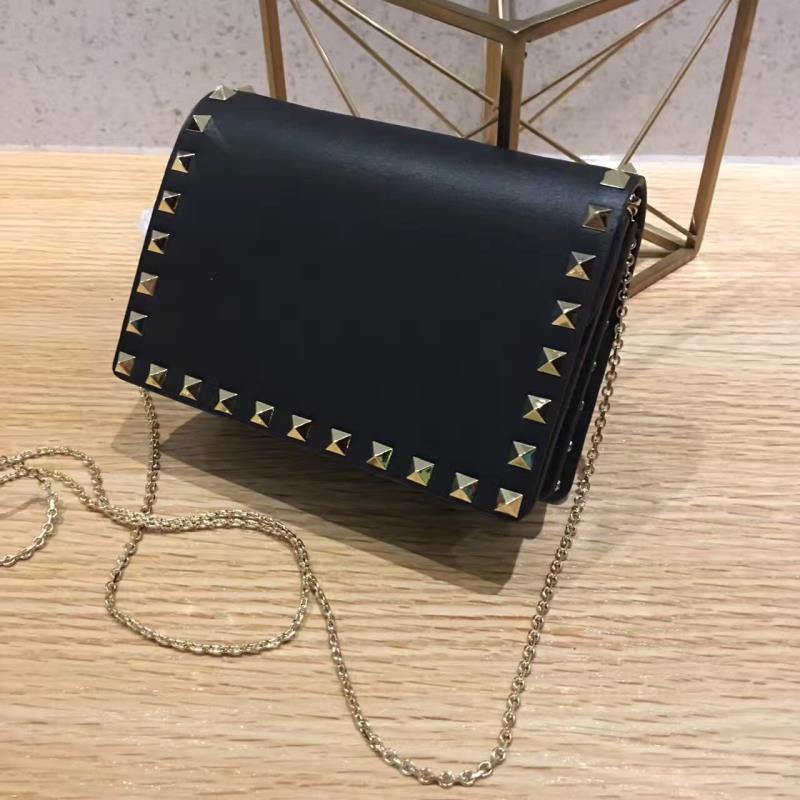 Valentino Garavani Rockstud leather clutch 01327 black